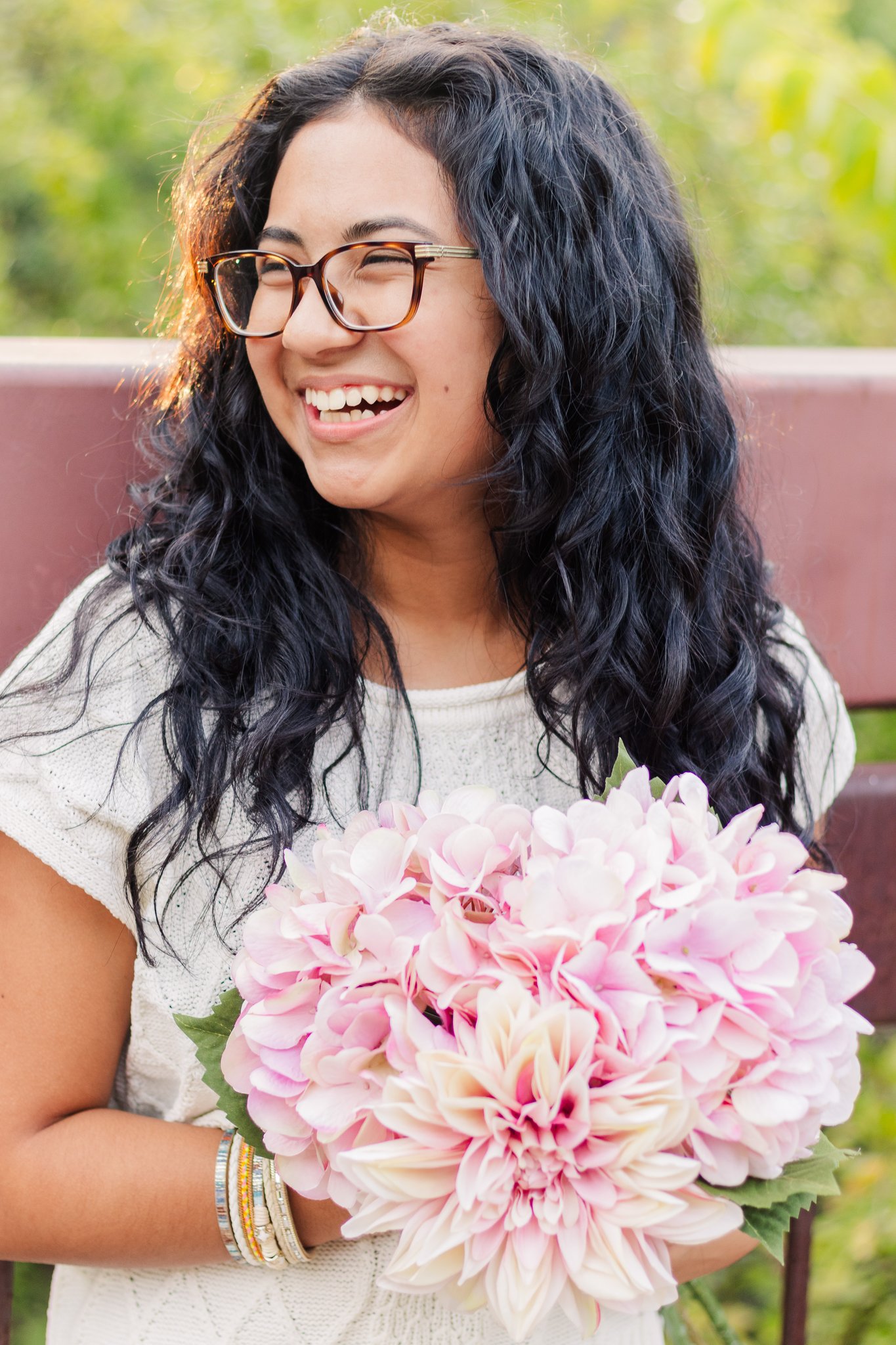 girl is laughing because she feels comfortable in front of the camera